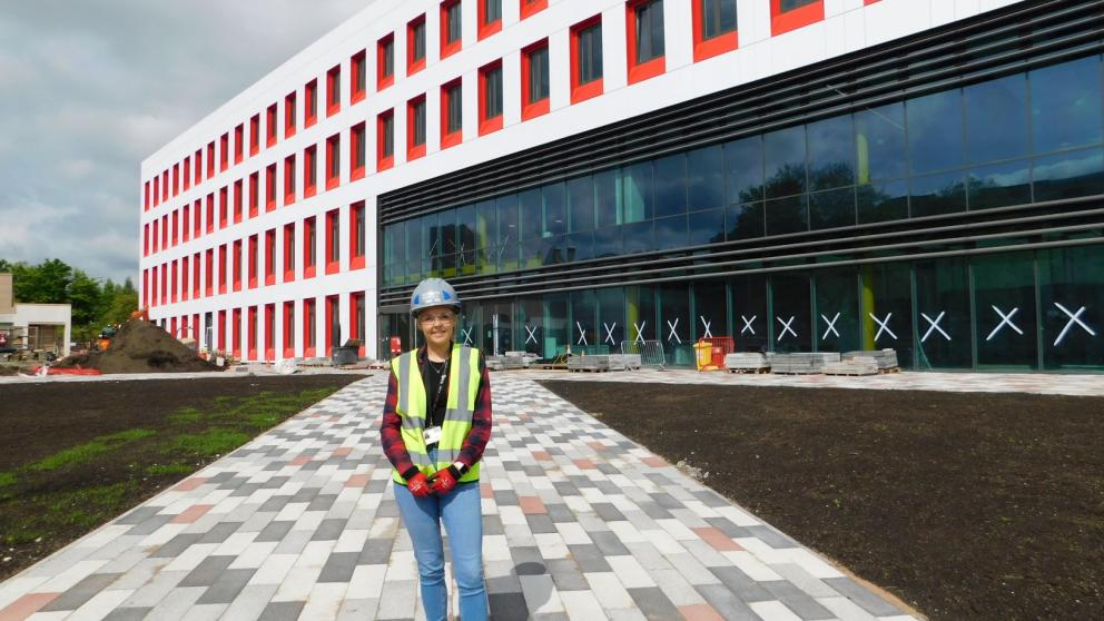 Charlotte France, BSc Building Surveying alumni outside the Science, Engineering & Environment (SEE) Building, University of Salford