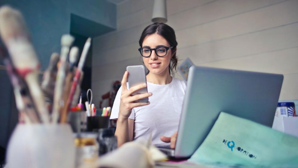 A person works at a laptop