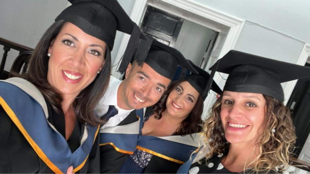 Students in their graduation caps and gowns