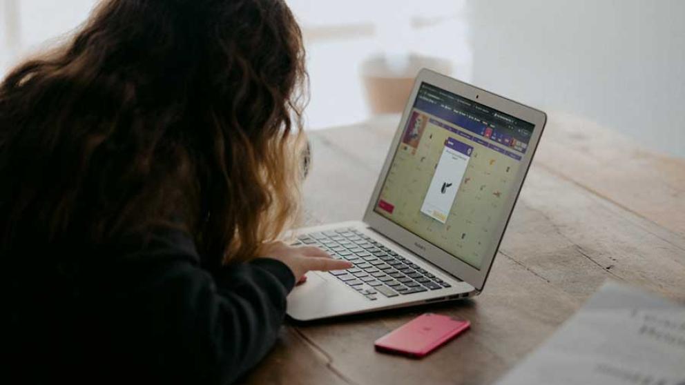 A person works on a laptop