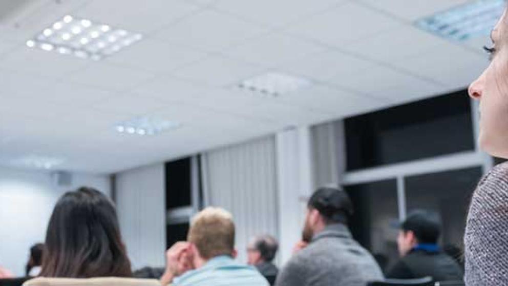 A person attends a lecture