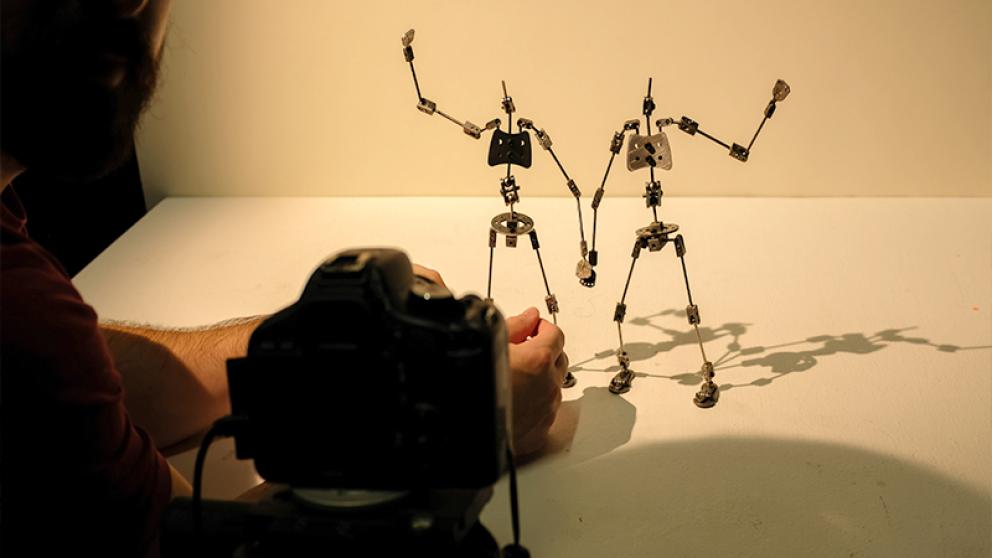 Student filming stop motion models at the MediaCity campus