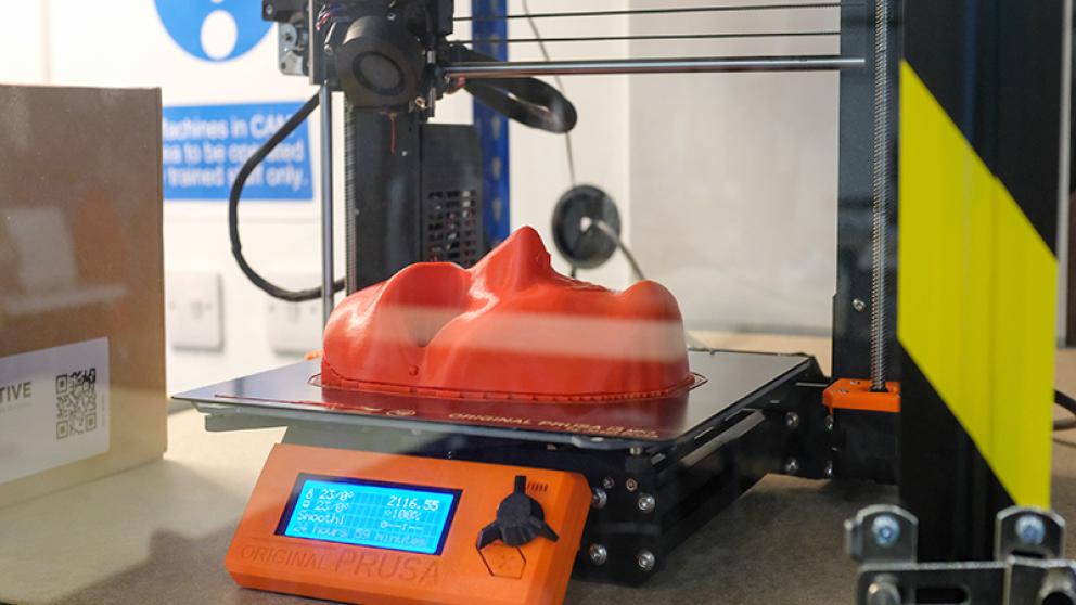 3d printer equipment with red face mask