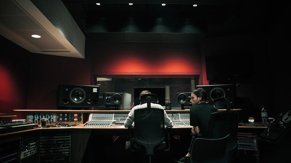 Two students working in a recording studio