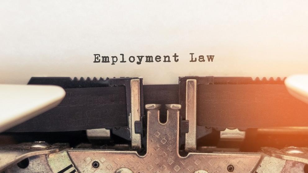 The words 'Employment Law' typed on a vintage typewriter