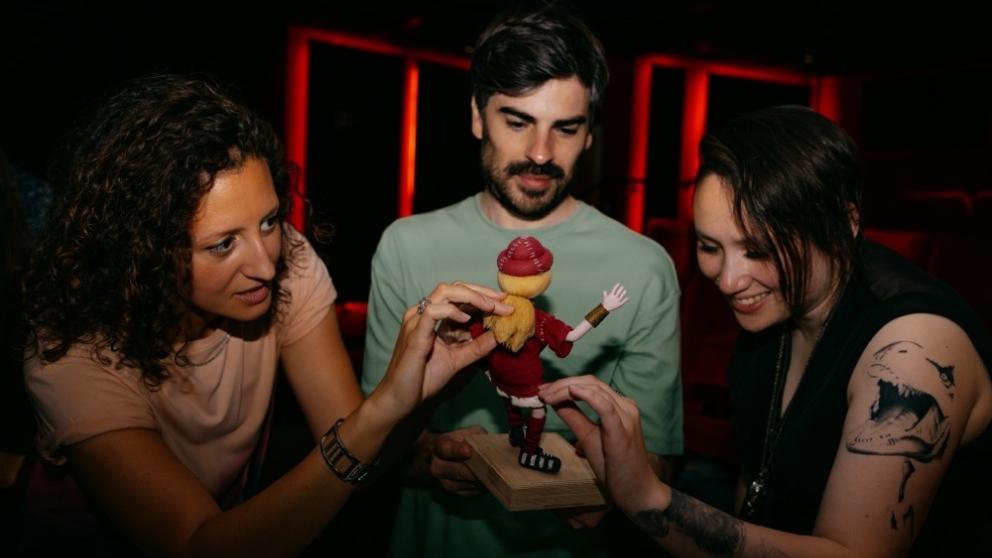 Still of animators modelling Aardman clay