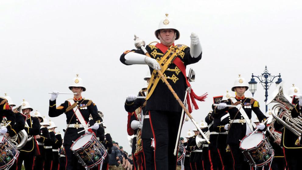 Band of marines playing instruments in the street