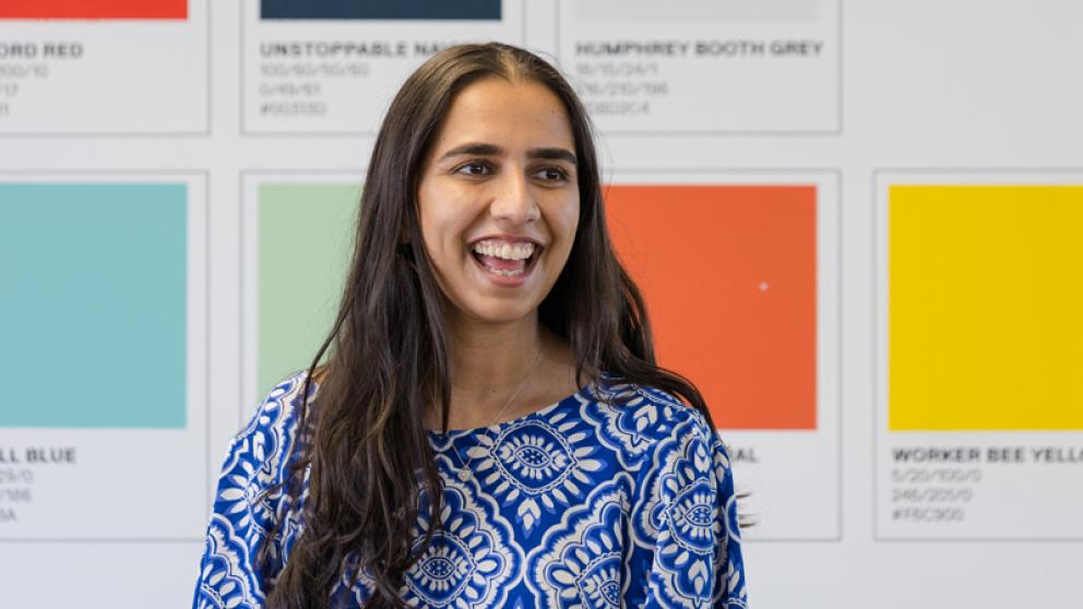 Office colleague sat in front of a colour printers chart