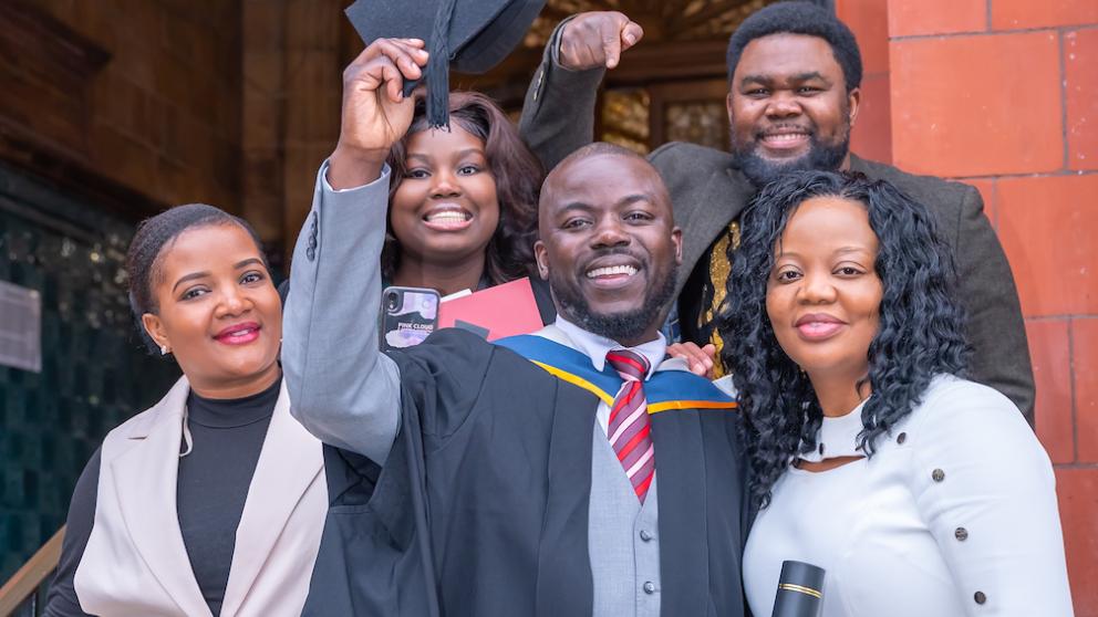 graduate with family