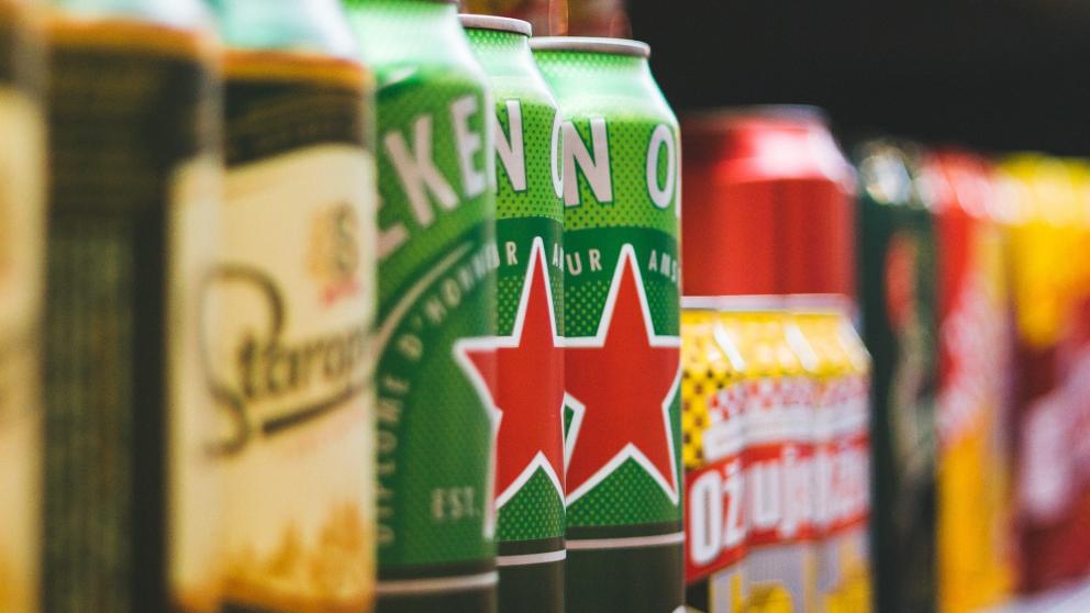 Branded beer cans on a shelf