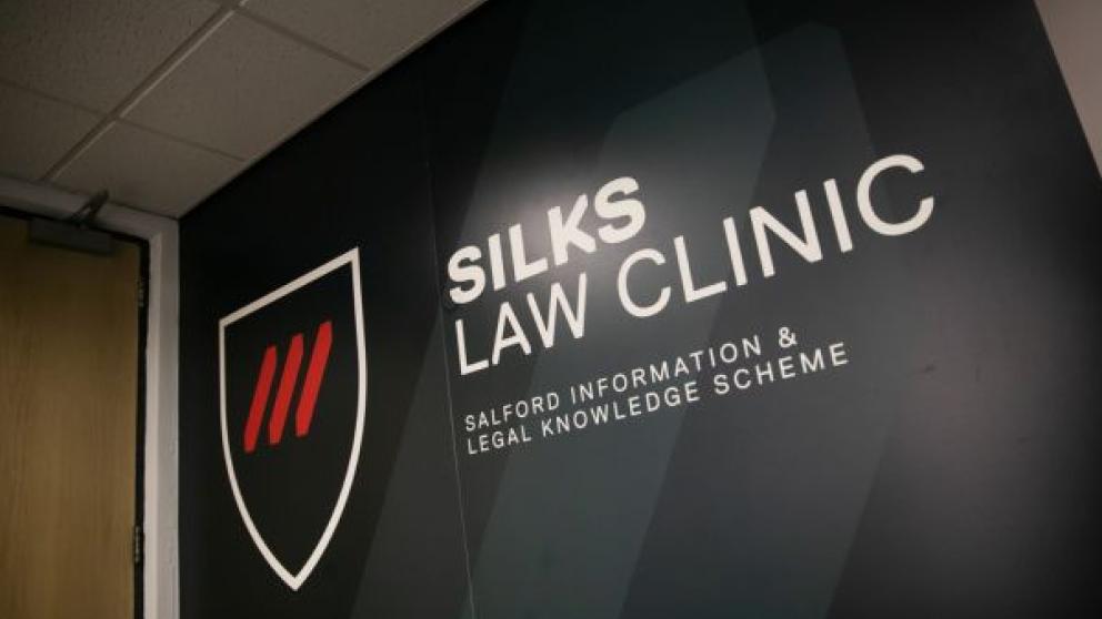 SILKS Law display against a wall