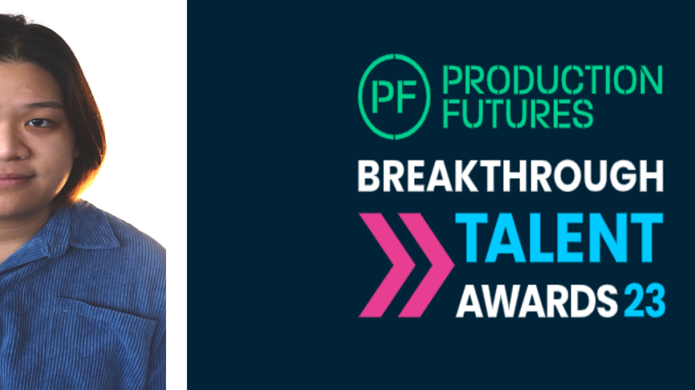 Graduate Yi Wen Limm next to a banner for the Production Futures Breakthrough Talent Awards