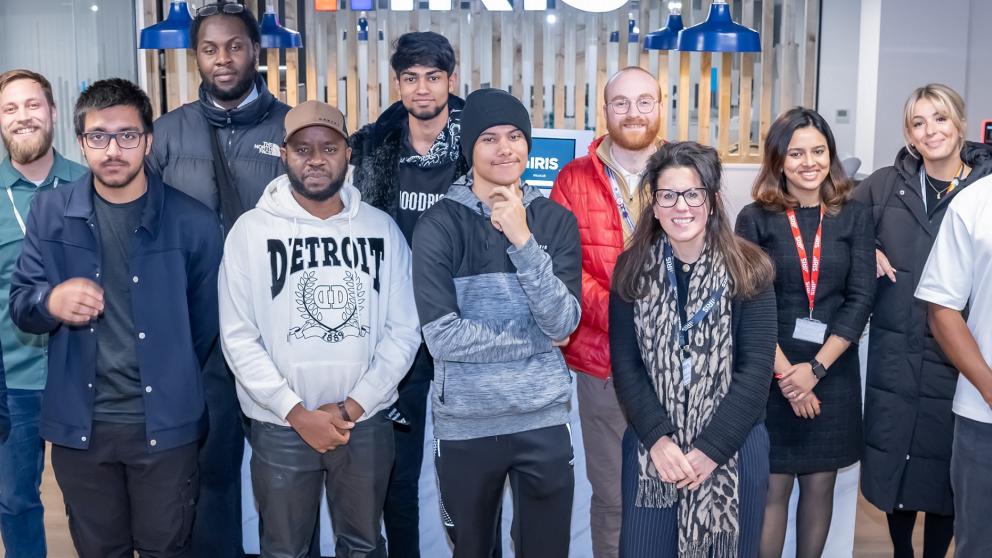 12 people posing for a photo at IRIS event