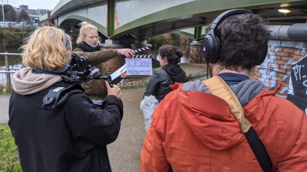 A group of people filming