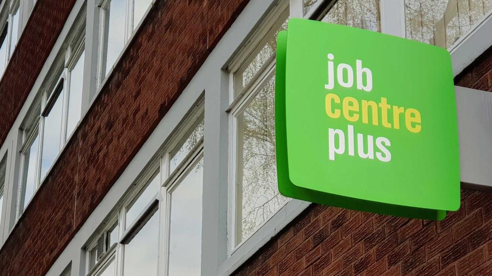 Jobcentre plus sign on a building