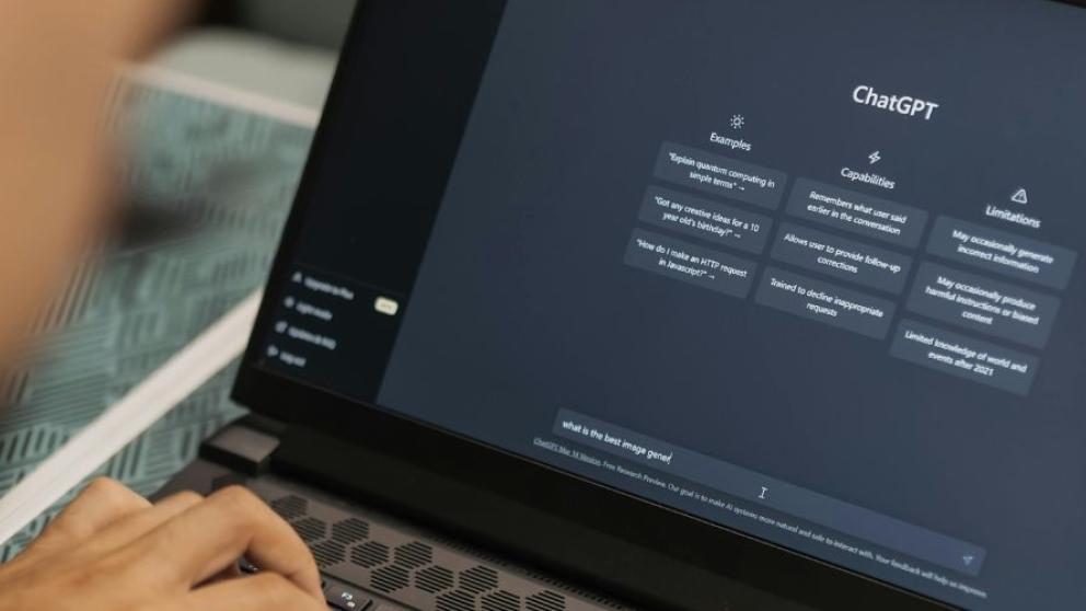 Man using ChatGPT on laptop