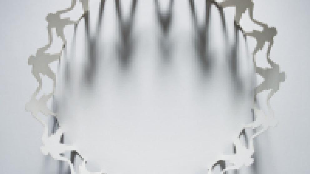 paper cut out figures standing in a circle