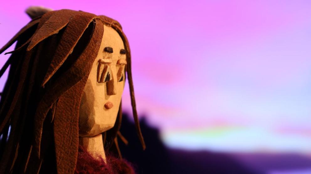 An animation women looks out to sea in front of a purple hued background
