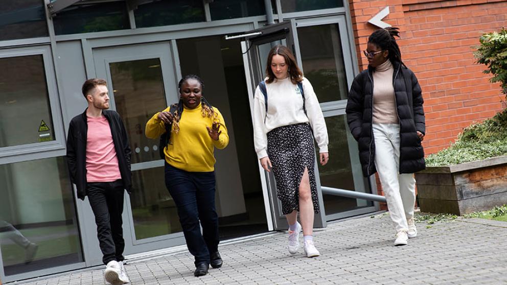 Students leaving Peel Park Quarter Accommodation after a viewing