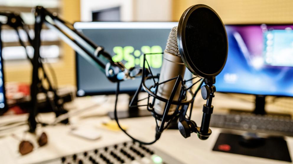 A microphone in front of a laptop at Bauer Media