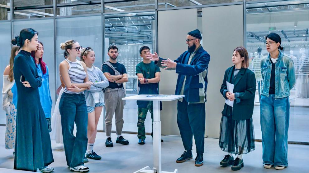 Bashir (two in from far right) addresses students at the China Academy of Art 