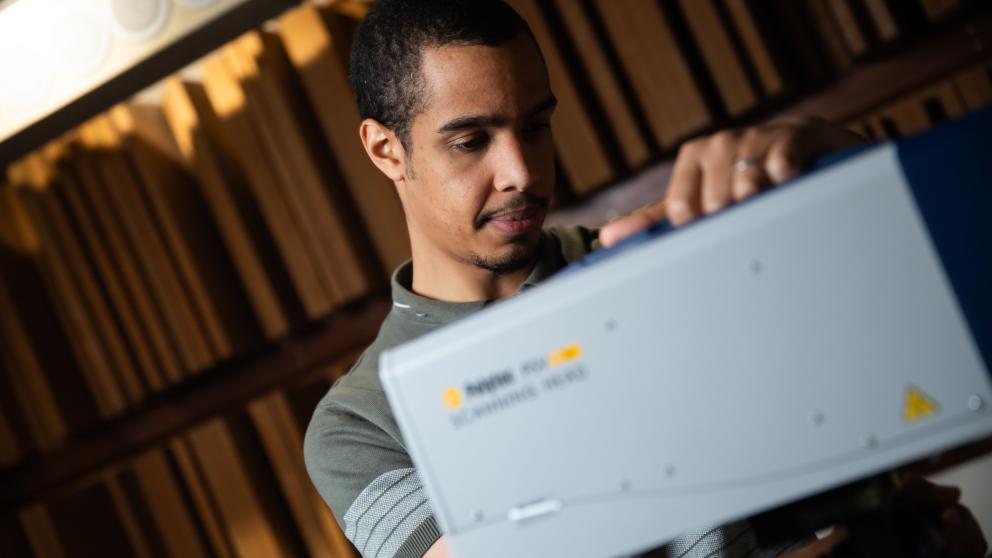 Acoustics student using equipment