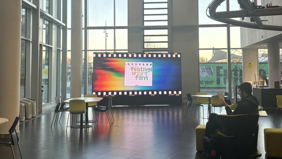 The MediaCity lobby area with a big screen saying Festival of Short Film