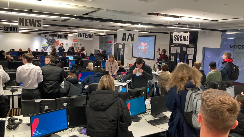 The MediaCity newsroom full of students 