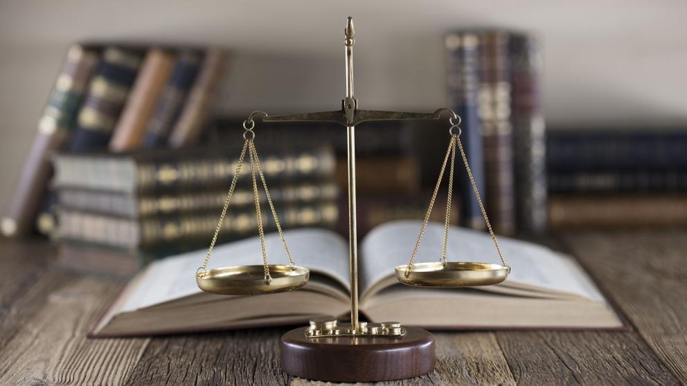 Law books and scales of justice