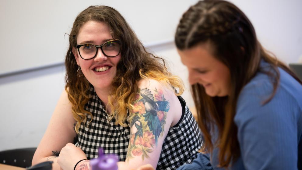 Two work colleagues in conversation
