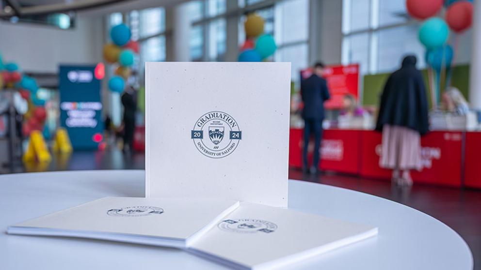 Graduation 2024 brochure in the check-in area at MediaCity, University of Salford