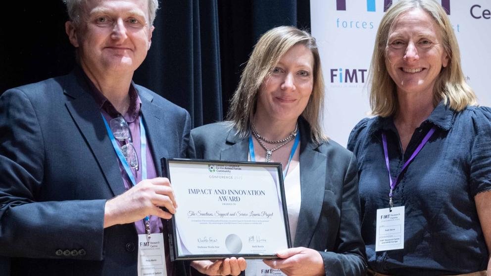 Research Fellow Dr Philip Martin and Professor Lisa Scullion are presented with the Impact and Innovation Award at the FiMT Research Centre conference
