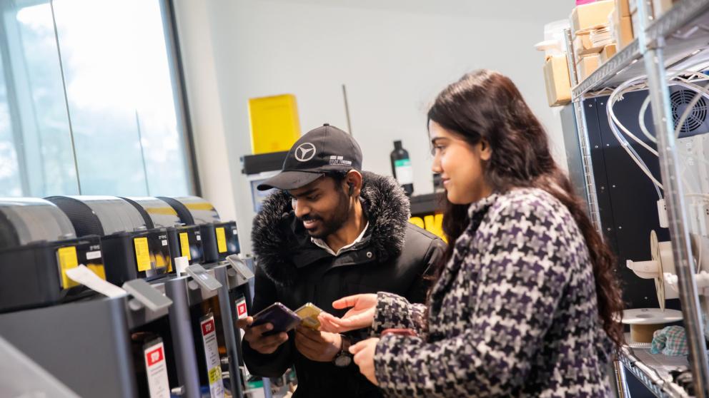 Aeronautical Engineering students working at a 3D printer