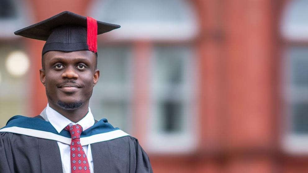 Charlton at graduation outside Peel Building