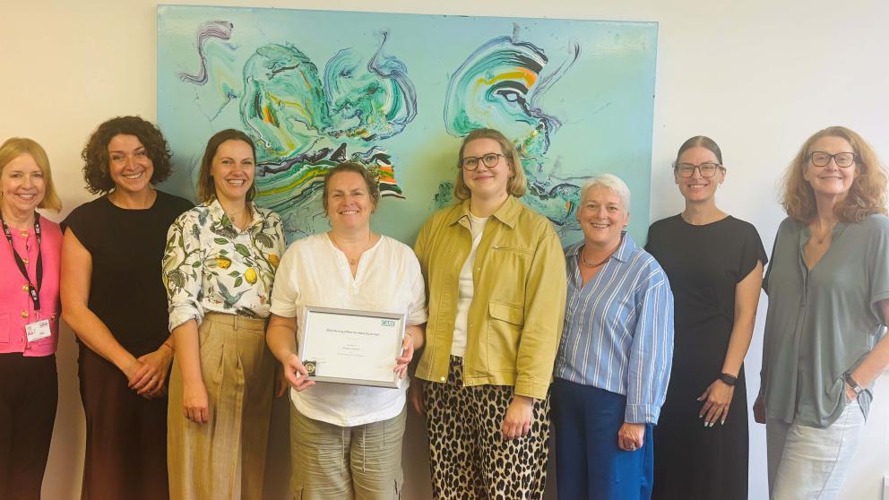 Melanie Stephens receiving the Chief Nursing Officer for Adult Social Care Gold Award