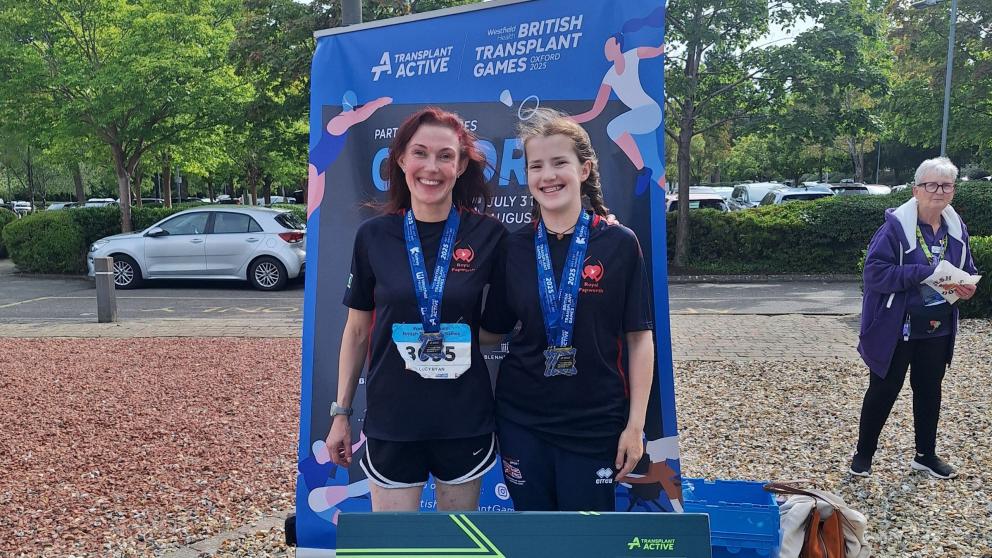 Lucy with a medal and a fellow contestant