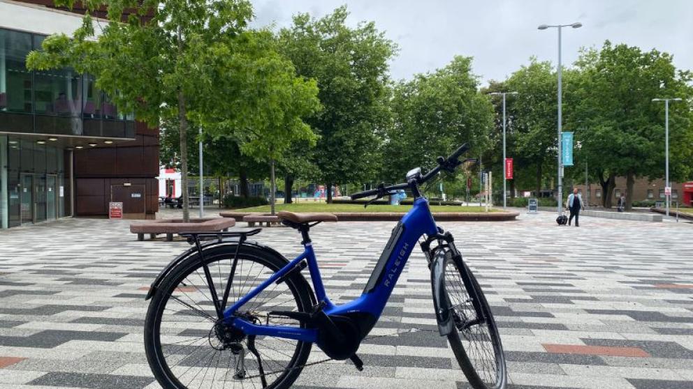 Blue bicycle in Chapman Square, Peel Park Campus