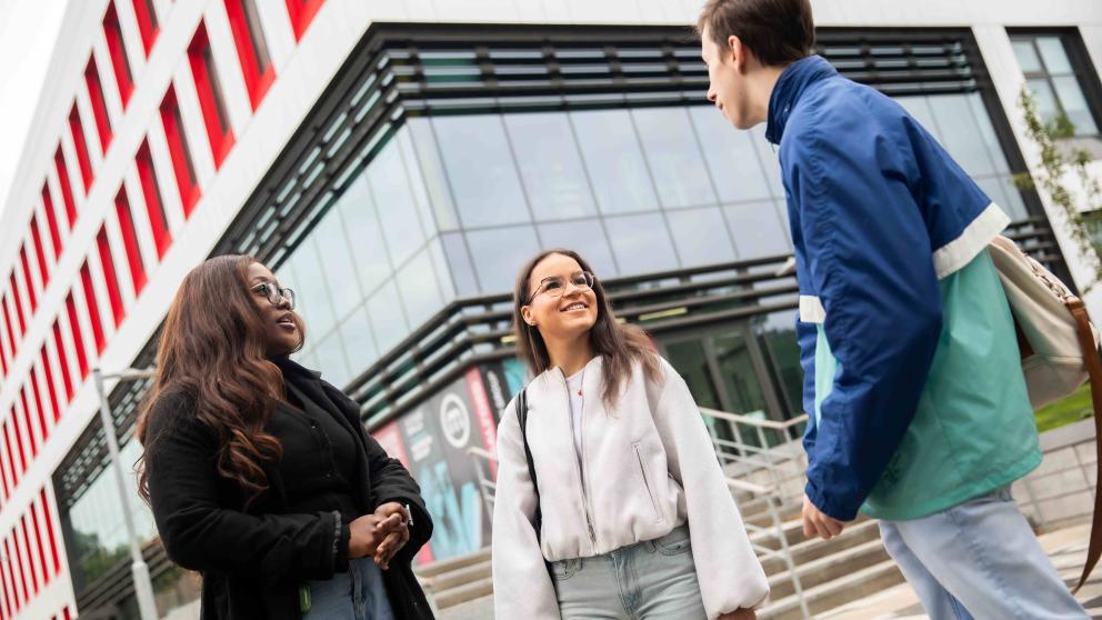 students outside SEE building
