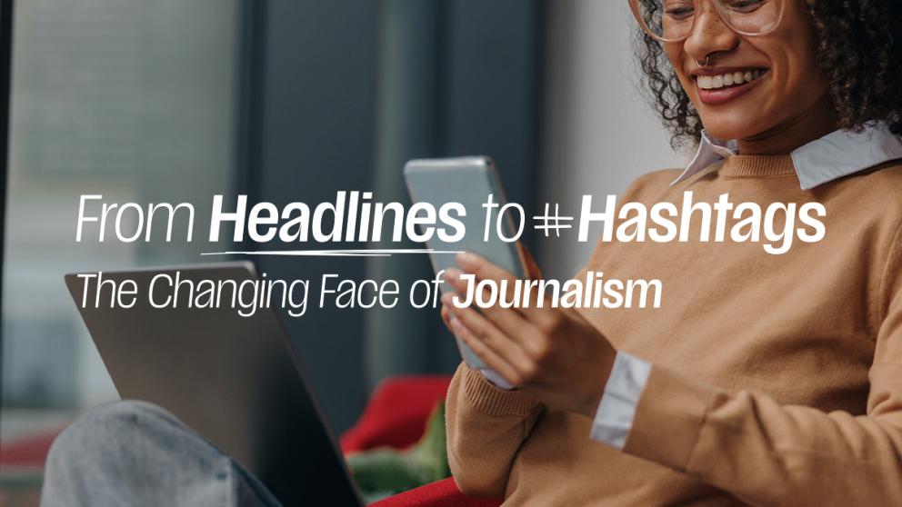 A woman looks at her phone while smiling