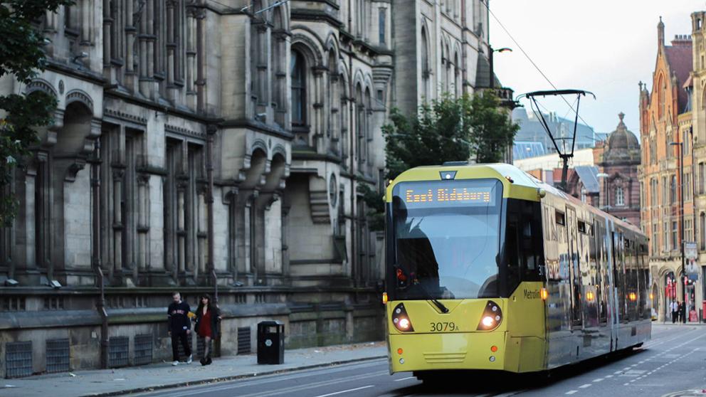 Tram travelling through Manchester city centre
