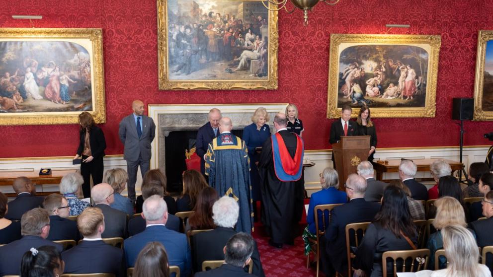 Professor Nic Beech and Professor Will Swan receive an award from The King and Queen