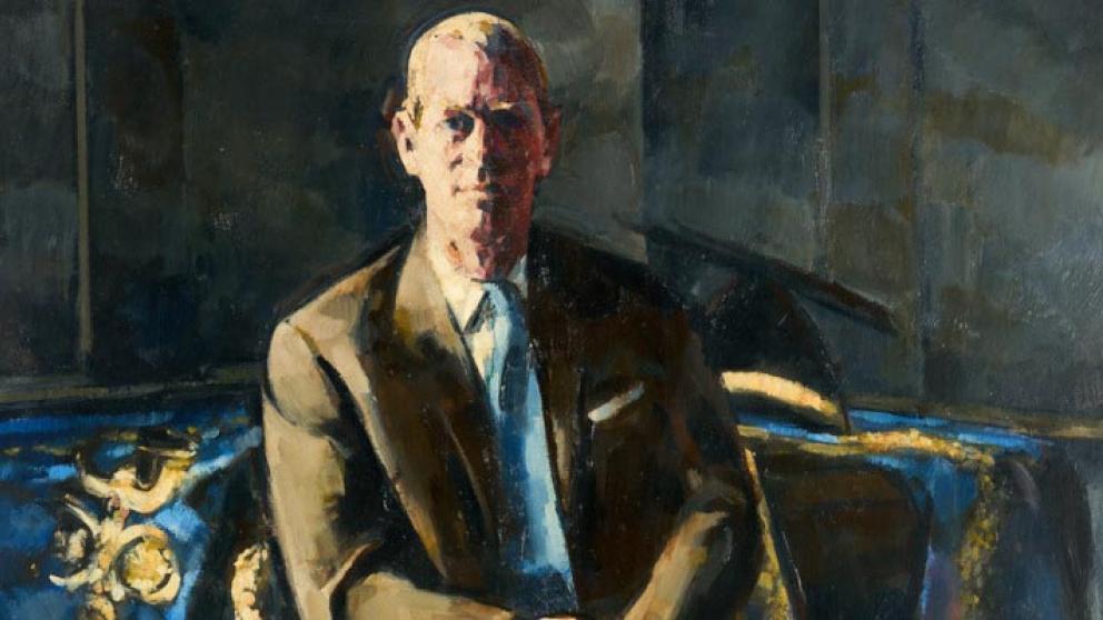 Oil painting of Prince Philip in a brown suit, with a blue patterned cloth draped over a table behind him.
