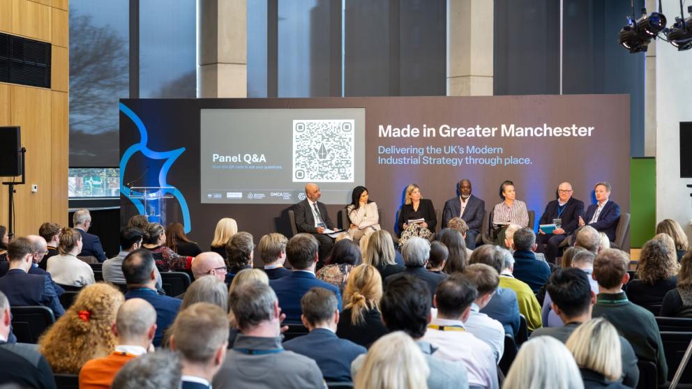 A panel discussion in front of an audience