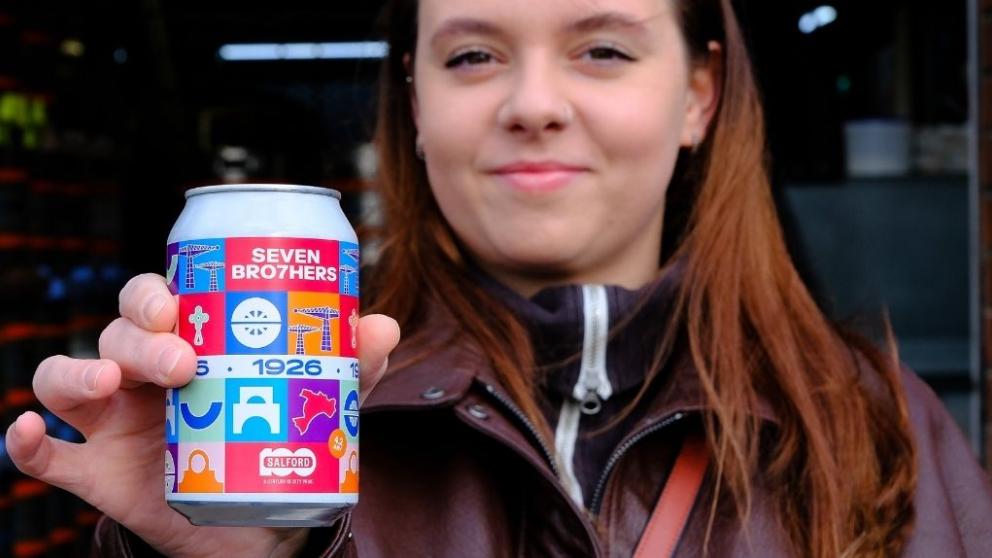 Anhelina holds a can of the new Seven Brothers Ale