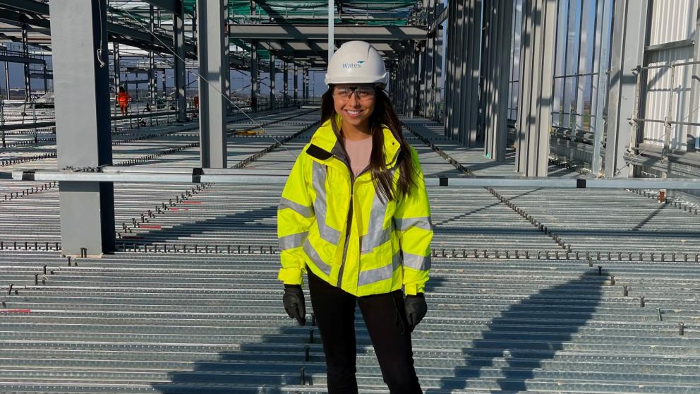 Hannah Daly in hardhat and hi-vis - BSc (Hons) Quantity Surveying 
