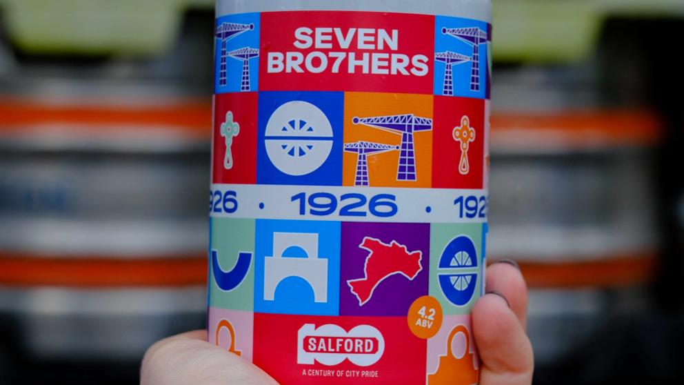A hand holding the ale can designed by graphic design student Anhelina