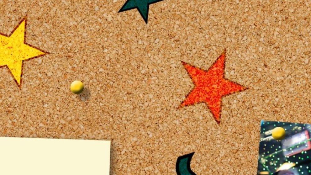 Cork bulletin board with stars and pictures