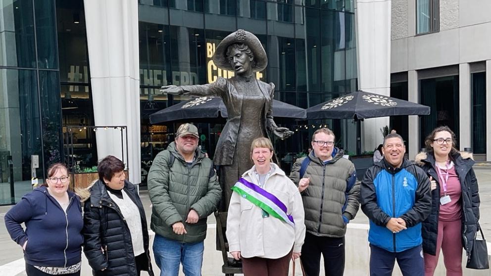 Oldham Personal Advocacy Limited (OPAL) group smiling together in Manchester City centre
