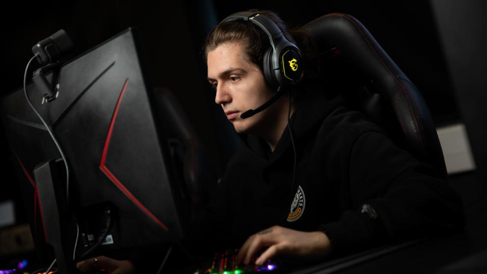 student on computer in esports lab