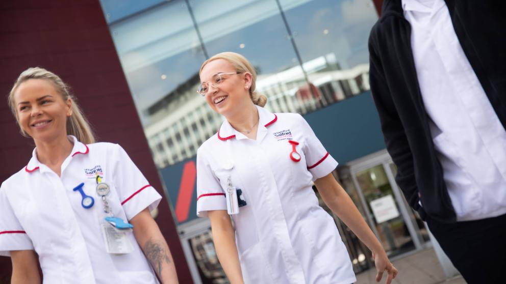 Student Nurses Walking Outside Mary Seacole Building